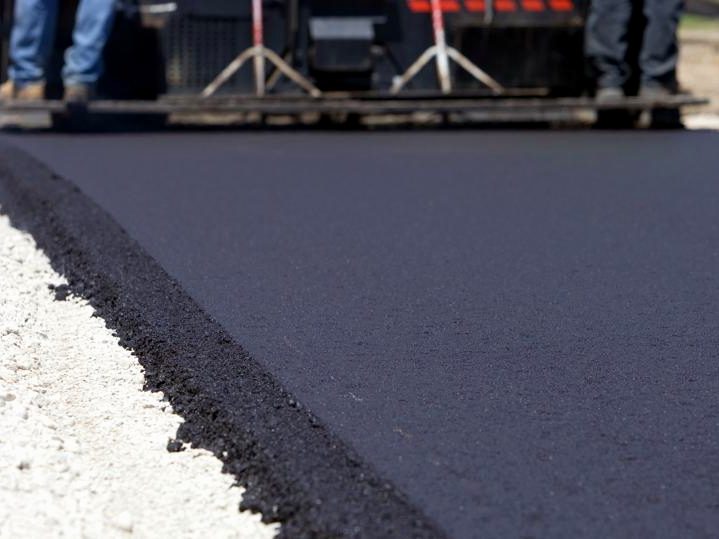 Hot-mix asphalt being laid — full-service asphalt work