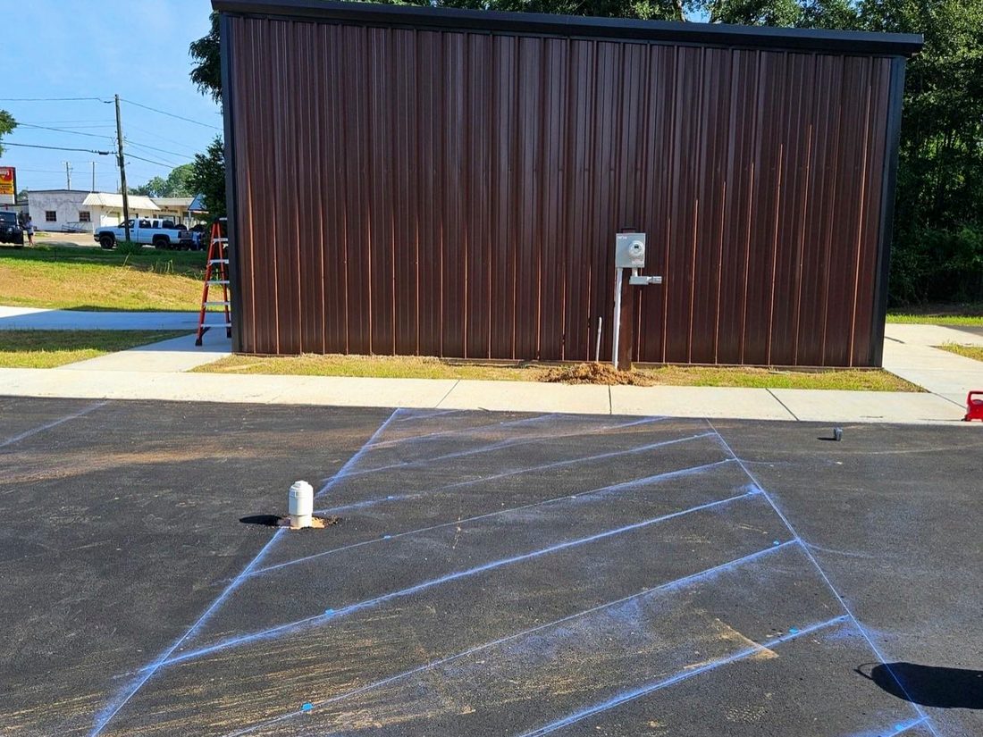 Commercial lot freshly sealed and marked for striping